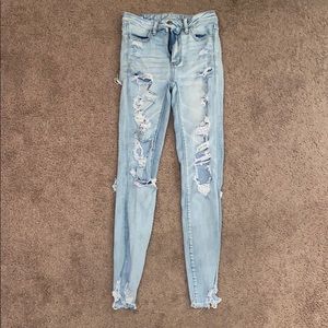 Ripped, light wash jeans.